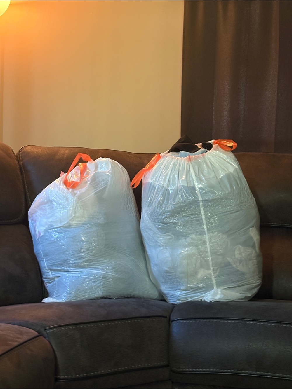 Plastic Trash Bags full of men’s clothes L/XL